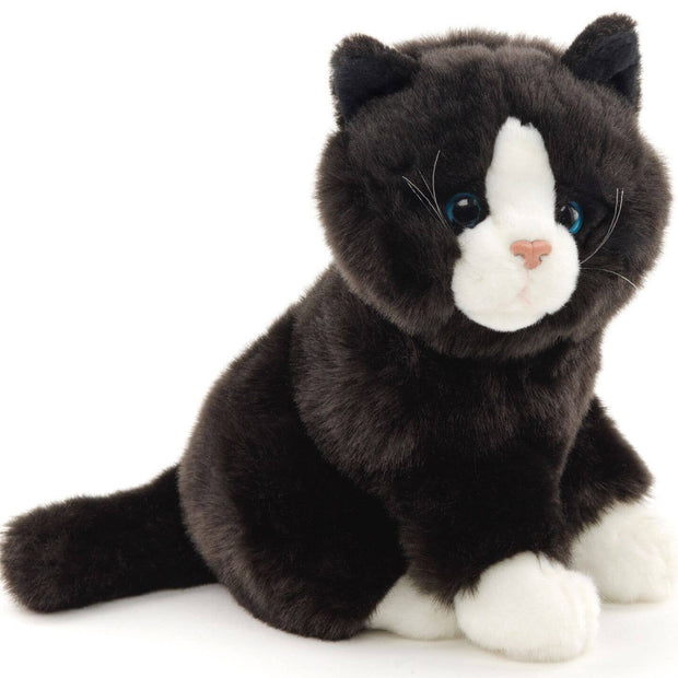 Black and white cat sitting - cuddly/plush toy