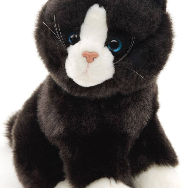 Black and white cat sitting - cuddly/plush toy